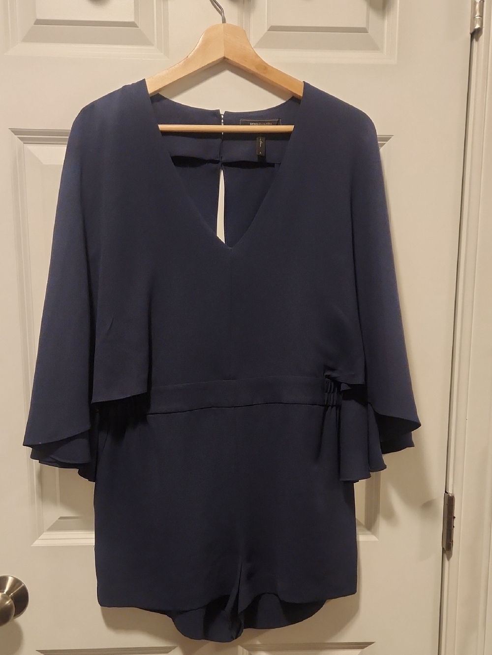 BCBGMaxAzria Navy V-Neck Romper with Flutter Sleeves.